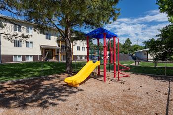 Outdoor children's playground with yellow slide
